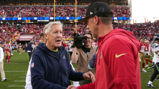 Dec 10, 2023; Santa Clara, California, USA; Seattle Seahawks head coach Pete Carroll (left) shakes hands with San Francisco 49ers head coach Kyle Shanahan (right) after the game at Levi's Stadium. Mandatory Credit: Darren Yamashita-USA TODAY Sports